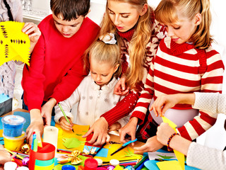 Child painting at art school.