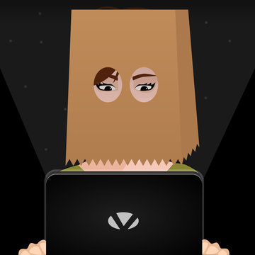 Girl with a bag in her head holding a Laptop