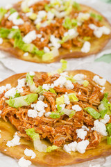 Tostadas - Mexican crispy tortilla with chicken tinga and cotija