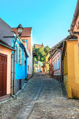 Fototapeta na wymiar Colorfull medieval street in Sighisoara