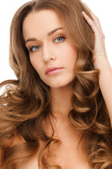 Fototapeta premium beautiful calm woman with long curly hair