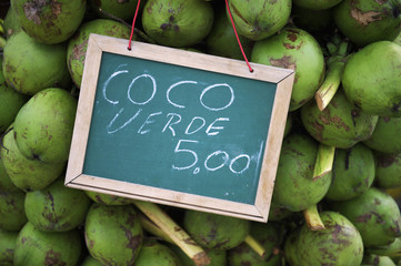Sign with green drinking coconuts in Rio de Janeiro Brazil