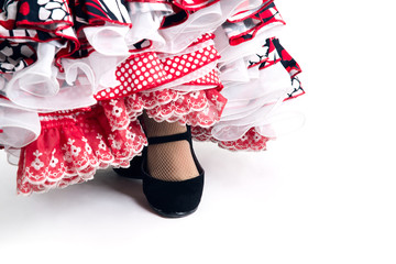 Feet detail of Flamenco dancer in beautiful dress