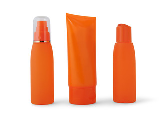 Three orange bottle with suntan cream