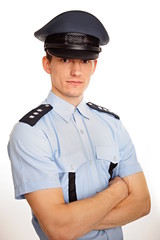 Portrait of young policeman on white background.