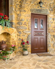 Fototapeta na wymiar Charming entrance of courtyard of old mediterranean village Spil
