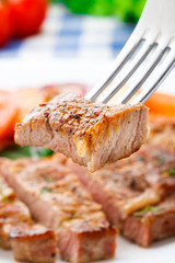 Piece of steak on fork