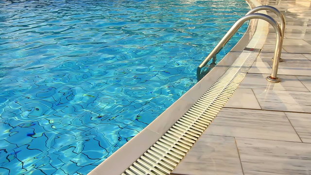 Marble edge pool and blue water