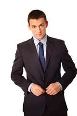 Young businessman standing in suit isolated on white backgrounds
