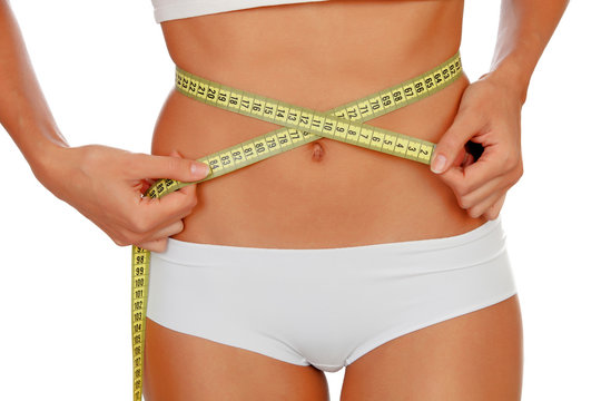 Girl in white underwear with a tape measure around her waist