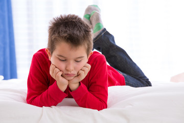 Unhappy Kid Looking Down