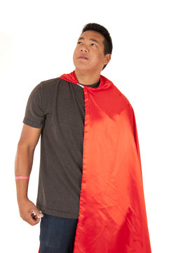 Asian Man In Red Cape Looking Far Away