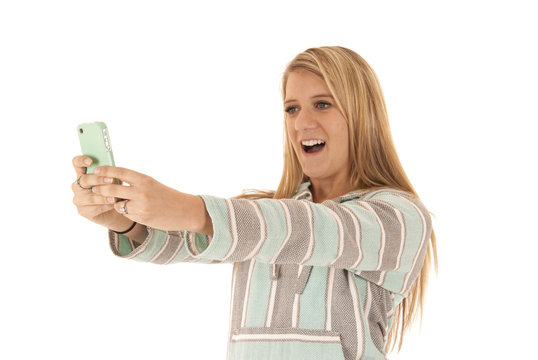 blonde woman talking cell phone picture of herself