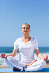Fototapeta na wymiar mid age woman meditating