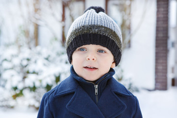 Adorable toddler boy on beautiful winter day
