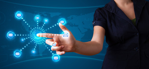 Woman pressing virtual messaging type of icons