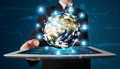 Businessman presenting 3d earth globe in tablet