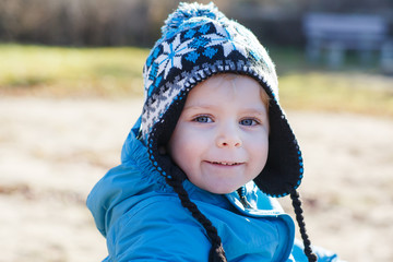 Portrait of little boy of two years outdoor