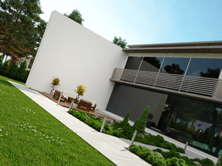 Modern house exterior with patio and garden