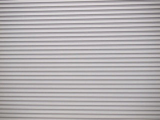 Obraz premium Illuminated grunge metallic roller shutter door