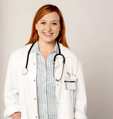 Young pretty smiling female doctor