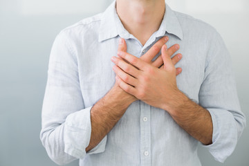 Mid section of a man with chest pain - Powered by Adobe