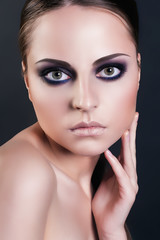 Fashion beauty portrait of attractive woman with smokey eyes