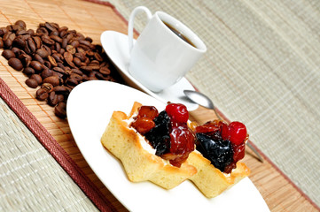Fruit cake on a plate and a cup of coffee