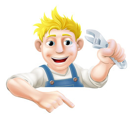 Cartoon mechanic peeping over banner