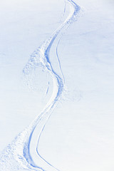 Skiing, snow - freeride tracks on powder snow - 57989249