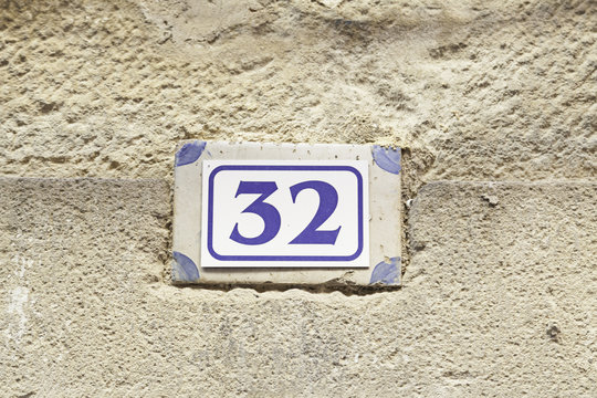 Number thirty-two on the wall - Powered by Adobe