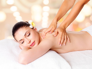 Obraz na płótnie Canvas Woman having massage of body in spa salon