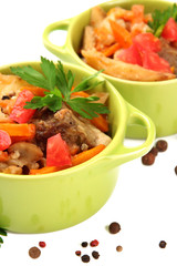Homemade beef stir fry with vegetables in color pans, isolated