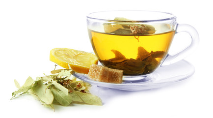 Transparent cup of herbal tea with herb isolated on white