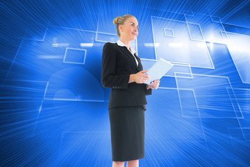 Composite image of businesswoman holding new tablet