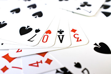 Word LOVE made ​​with playing cards color image
