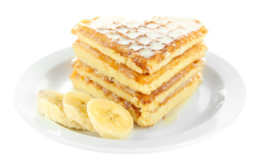 Sweet Belgium waffles with banana, isolated on white