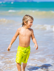 Happy young boy at the beach