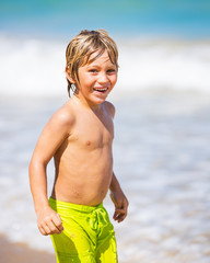 Happy young boy at the beach