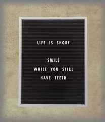 Funny, inspirational quotation about life on a very old menu boa