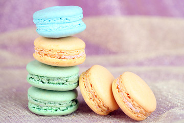 Macaroons on fabric background