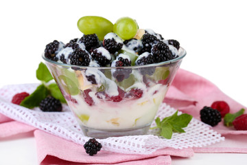 Fruit salad in glass bowl, isolated on white