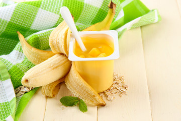 Tasty yogurt with pieces of fresh fruits, cookies and flakes,on