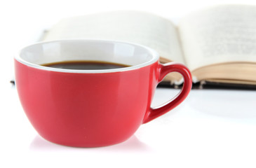 Cup of coffee and interesting book isolated on white
