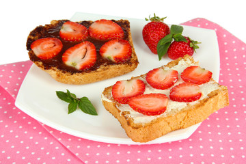 Delicious toast with strawberry on plate close-up
