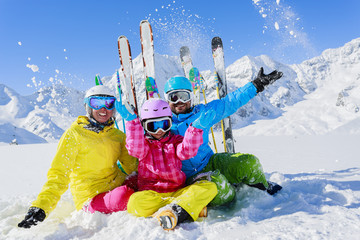 Ski, sun and fun - family enjoying winter holiday