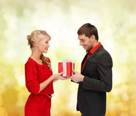 smiling woman and man with gift box