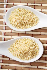 millet on white ceramic spoon