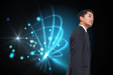 Composite image of serious asian businessman