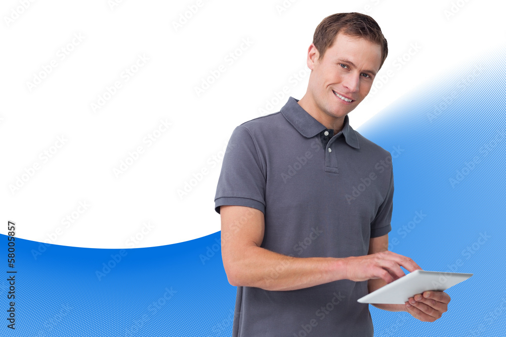 Poster Composite image of smiling young man with tablet computer